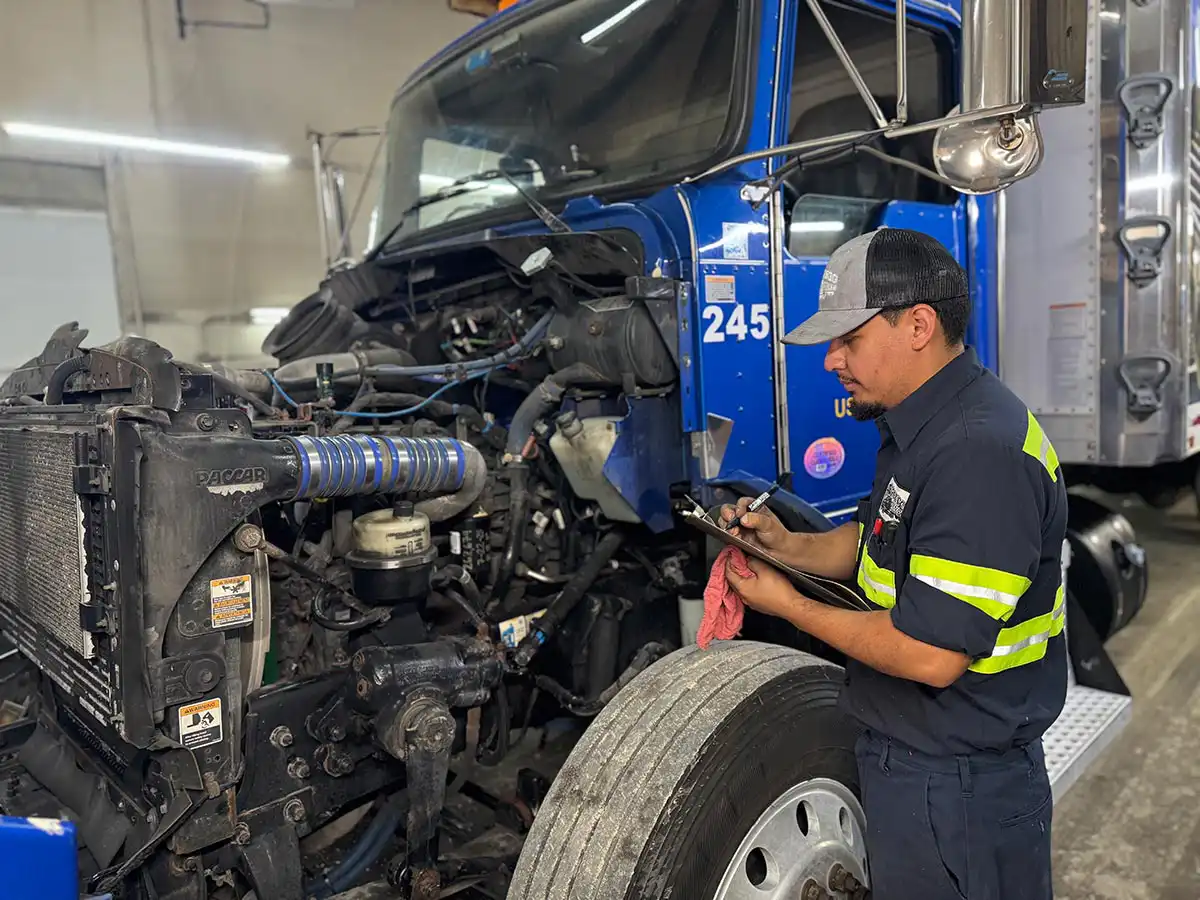 Inspector conducting DOT inspection on commercial vehicle