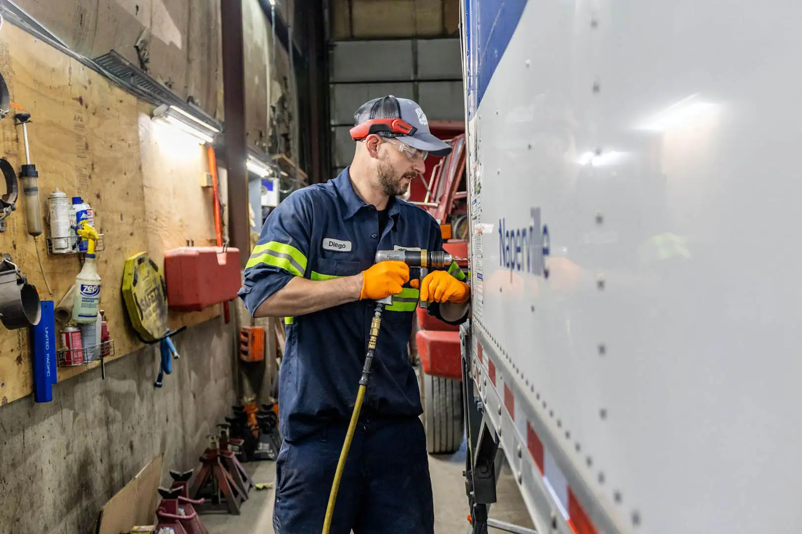Technician working on trailer brake system